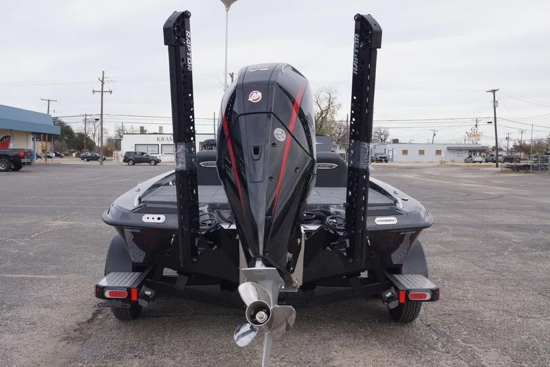 Slide: The Image of 2026 Phoenix 721 ZXL boat with powerful outboard motor in a parking lot. - 8