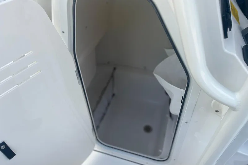 Slide: The Image of Interior compartment of 2026 Key West 219 FS boat, featuring storage space. - 23