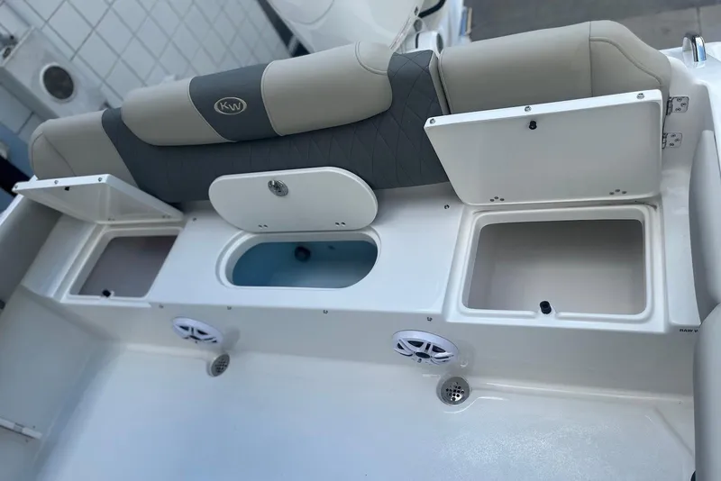 Slide: The Image of 2026 Key West 219 FS boat interior with storage compartments and seating. - 6