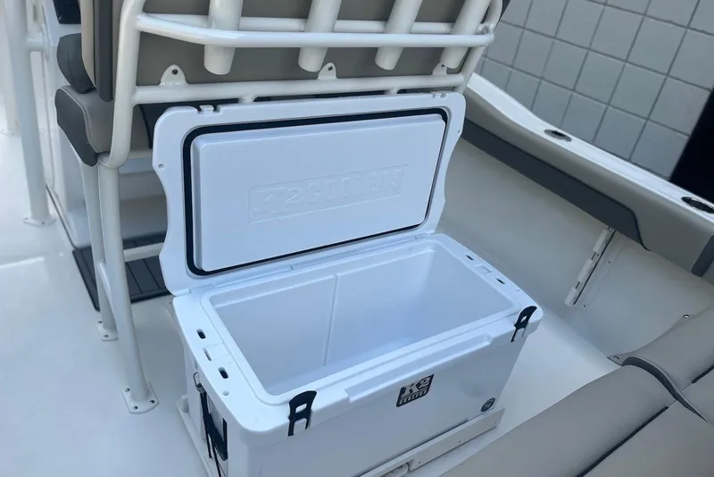Slide: The Image of Open cooler on 2026 Key West 219 FS boat, showcasing storage space. - 9
