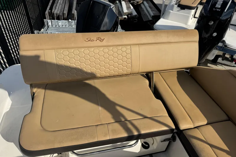 Slide: The Image of 2023 Sea Ray SDX 250 Outboard boat seating with tan upholstery and honeycomb pattern. - 14