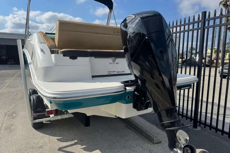 Slide: The Image of 2023 Sea Ray SDX 250 Outboard boat with powerful engine, parked outdoors. - 4
