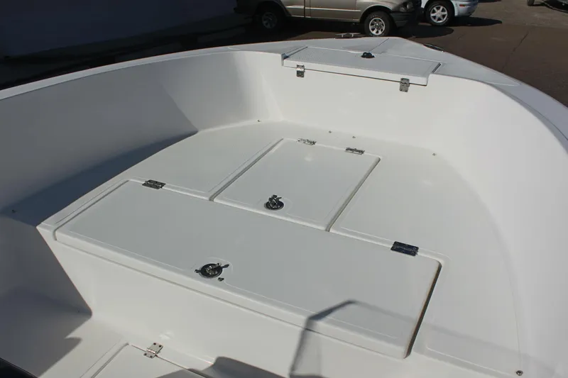 Slide: The Image of 2024 Clear Water 2000 CC boat deck with storage compartments. - 15