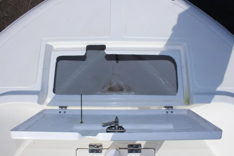Slide: The Image of 2024 Clear Water 2000 CC boat storage compartment with open hatch. - 20