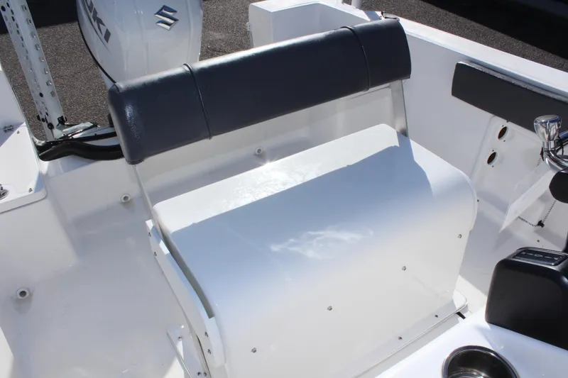 Slide: The Image of 2024 Clear Water 2000 CC boat interior with seating and controls. - 13