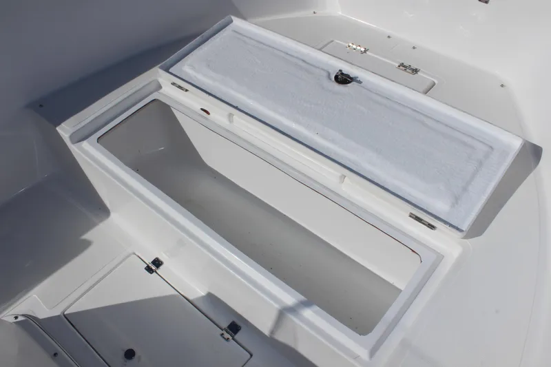 Slide: The Image of Open storage compartment on 2024 Clear Water 2000 CC boat, showcasing spacious interior design. - 18