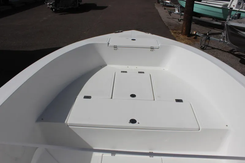 Slide: The Image of 2024 Clear Water 2000 CC boat interior with storage compartments, viewed from the bow. - 27