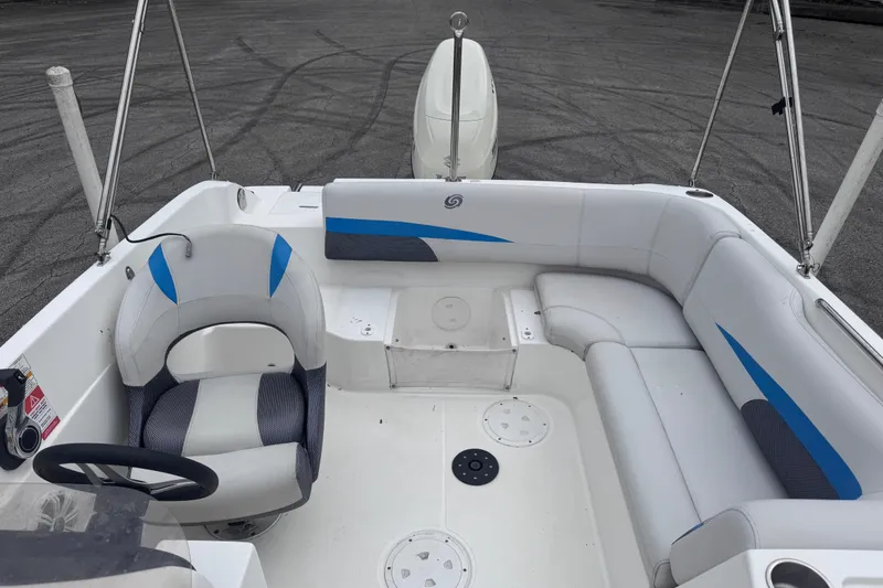 Slide: The Image of 2018 Hurricane SunDeck Sport 188 OB boat interior with seating and steering wheel. - 10