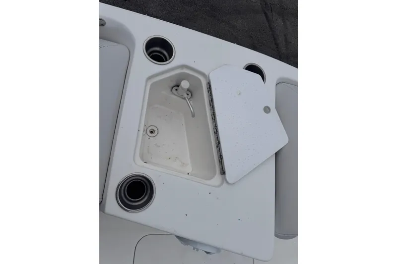 Slide: The Image of 2018 Hurricane SunDeck Sport 188 OB boat sink and cup holders on deck. - 12