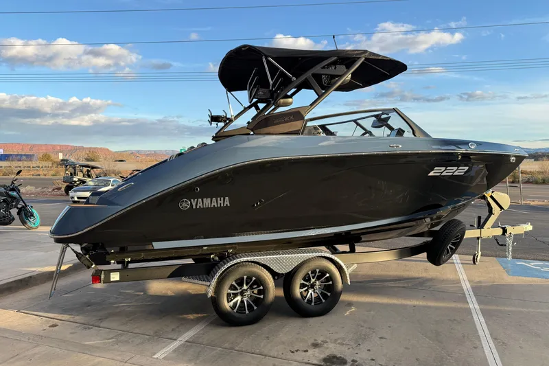 Slide: The Image of Close-up of 2026 Yamaha Boats 222XD logo in sunlight. - 10