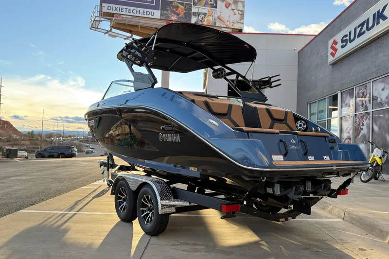 Slide: The Image of 2026 Yamaha Boats 222XD on trailer, parked outdoors under a clear sky. - 7