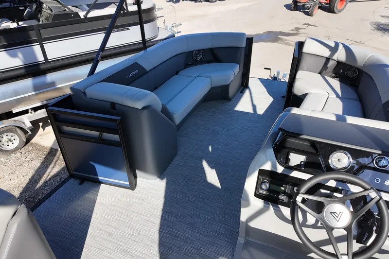 Slide: The Image of 2026 Viaggio Lago V 22 C pontoon boat interior with modern seating and steering console. - 10