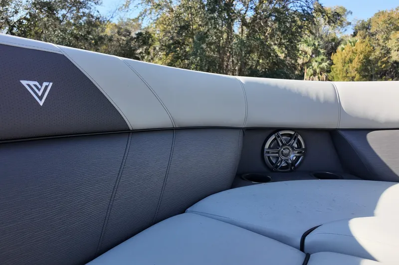Slide: The Image of Luxurious seating on 2026 Viaggio Lago V 22 C boat with speaker and cup holders. - 11