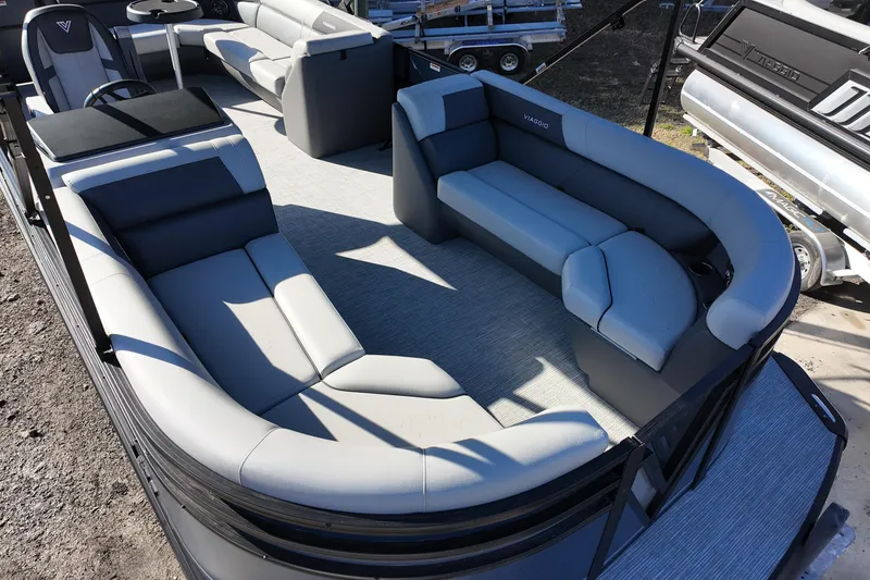 Slide: The Image of Luxurious 2026 Viaggio Lago V 22 C pontoon boat interior with plush seating. - 7