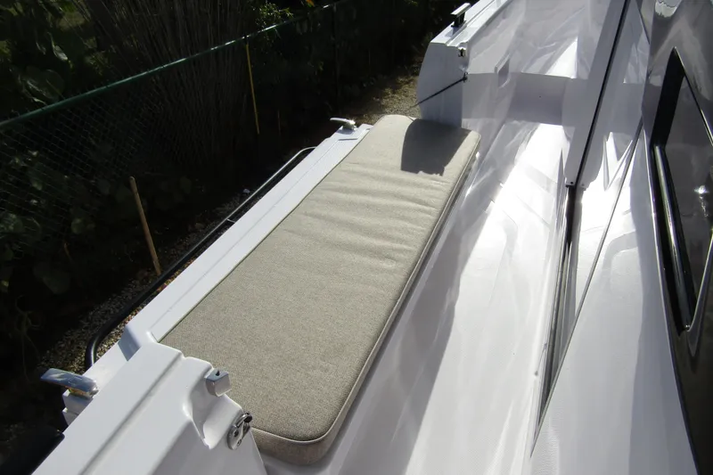 Slide: The Image of 2024 Axopar 45 XC Cross Cabin BRABUS Trim with sleek deck seating. - 14