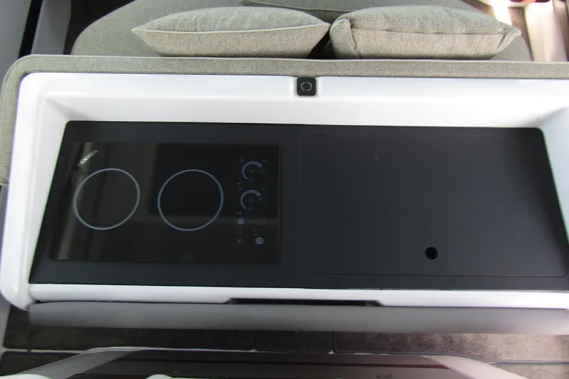 Slide: The Image of 2024 Axopar 45 XC Cross Cabin BRABUS Trim interior with modern stovetop. - 30