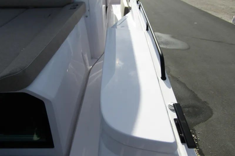 Slide: The Image of 2024 Axopar 45 XC Cross Cabin BRABUS Trim, deck view with seating and railing. - 45