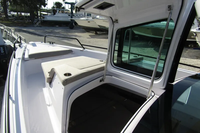 Slide: The Image of 2024 Axopar 45 XC Cross Cabin BRABUS Trim with open cabin and cushioned seating. - 9