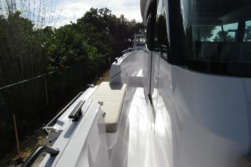 Slide: The Image of 2024 Axopar 45 XC Cross Cabin BRABUS Trim, side view with sleek design and seating. - 13