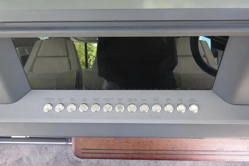 Slide: The Image of Control panel of 2024 Axopar 45 XC Cross Cabin BRABUS Trim with labeled buttons. - 17