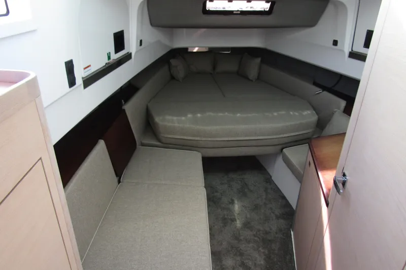 Slide: The Image of 2024 Axopar 45 XC Cross Cabin BRABUS Trim interior with cozy sleeping area. - 22