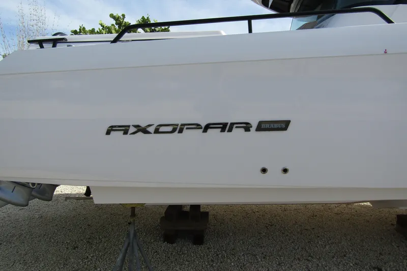 Slide: The Image of 2024 Axopar 45 XC Cross Cabin BRABUS Trim, side view with logo. - 3