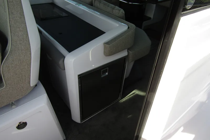 Slide: The Image of Interior of 2024 Axopar 45 XC Cross Cabin BRABUS Trim, featuring sleek seating and cabinetry. - 34