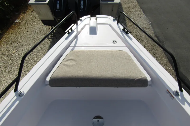 Slide: The Image of 2024 Axopar 45 XC Cross Cabin BRABUS Trim, bow seating area with dual outboard engines. - 4