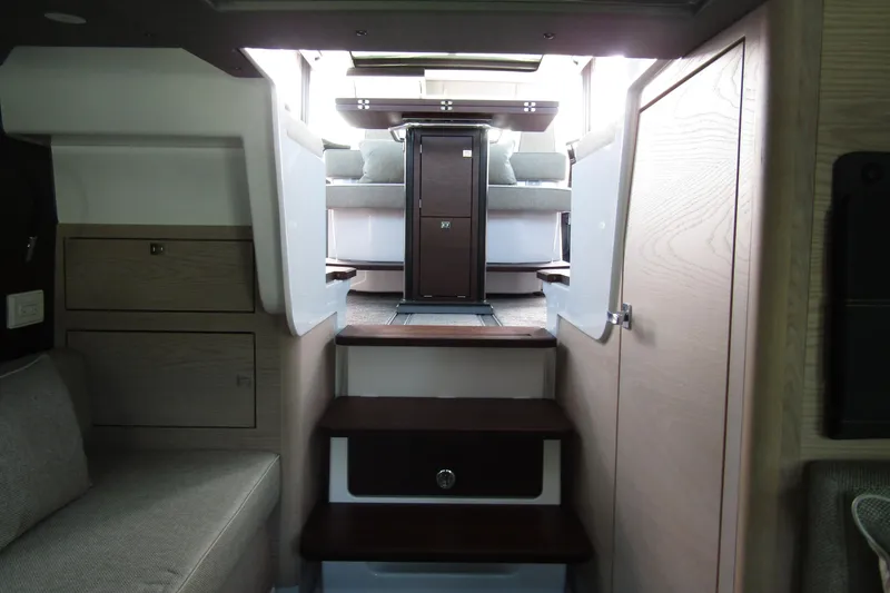 Slide: The Image of 2024 Axopar 45 XC Cross Cabin interior with modern design and wooden accents. - 43