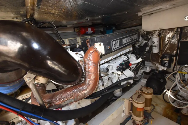 Slide: The Image of Engine room of a 1998 Cabo 45 Express with CAT Marine Power engine. - 21