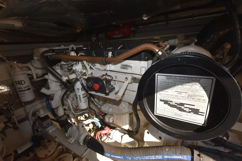 Slide: The Image of 1998 Cabo 45 Express engine room with Caterpillar marine diesel engine. - 22