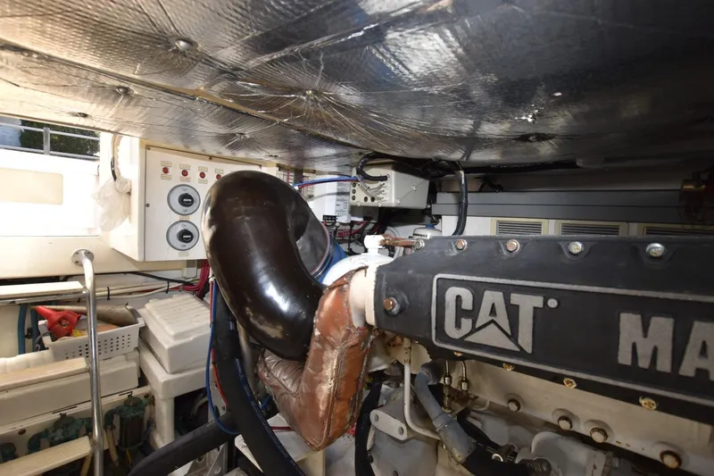 Slide: The Image of Engine room of 1998 Cabo 45 Express boat with CAT machinery and control panels. - 25