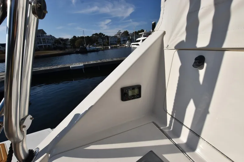Slide: The Image of 1998 Cabo 45 Express boat detail with marina view in the background. - 5