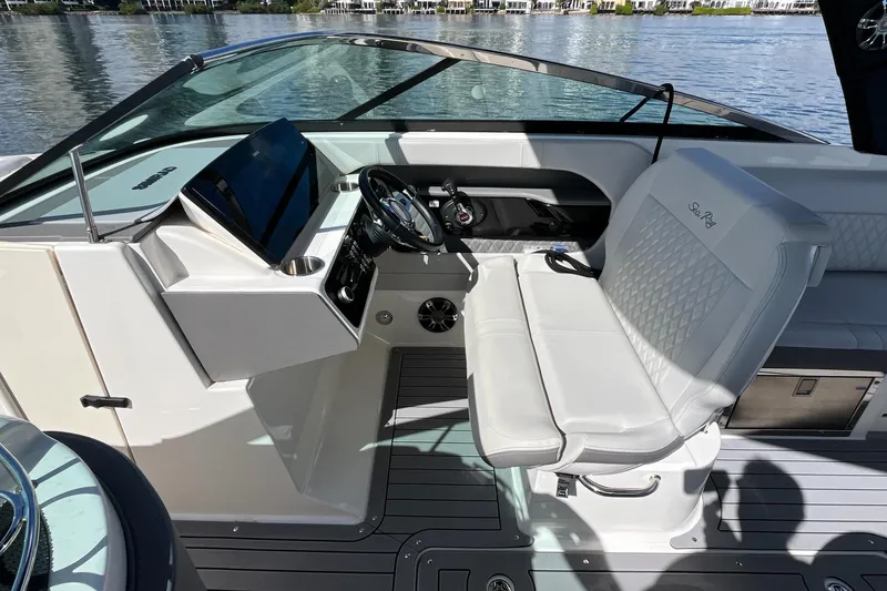 Slide: The Image of 2021 Sea Ray SLX 280 boat interior with modern helm and luxurious seating. - 17