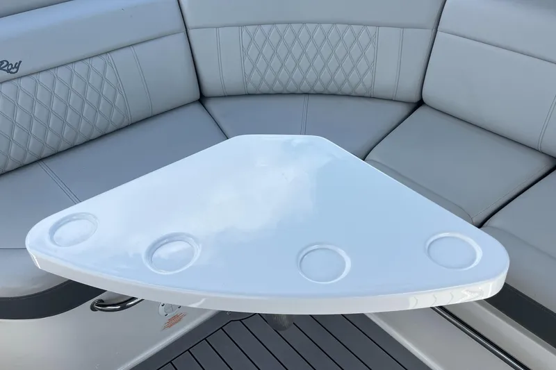 Slide: The Image of Interior of 2021 Sea Ray SLX 280 boat with cushioned seating and table. - 31
