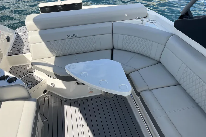 Slide: The Image of Luxurious 2021 Sea Ray SLX 280 boat interior with elegant seating and table. - 33