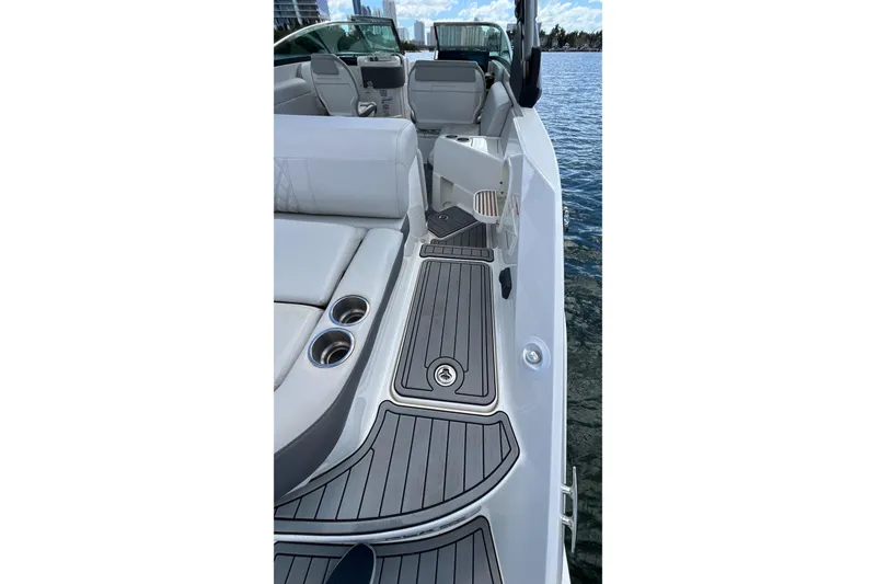 Slide: The Image of 2021 Sea Ray SLX 280 boat interior with sleek seating and cup holders. - 34