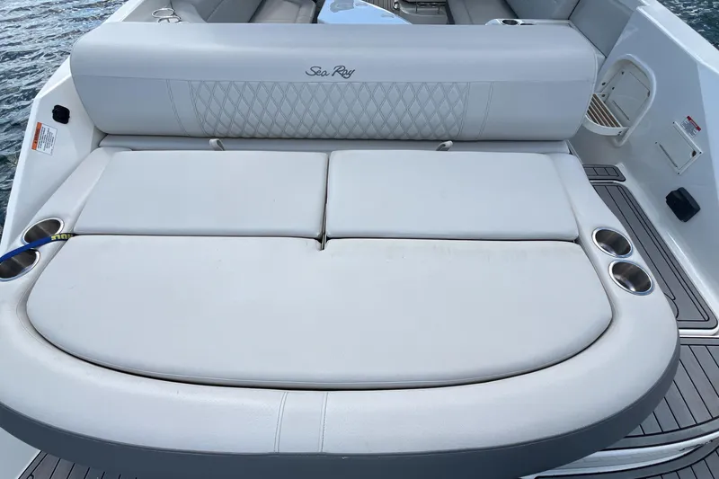 Slide: The Image of 2021 Sea Ray SLX 280 boat with spacious rear seating and cup holders. - 36