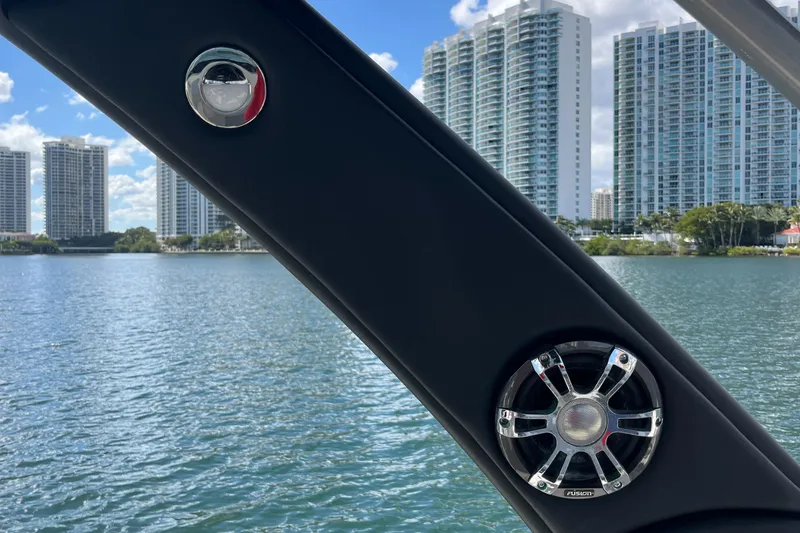 Slide: The Image of 2021 Sea Ray SLX 280 boat with speaker, city skyline in background. - 41