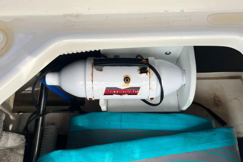 Slide: The Image of 2021 Sea Ray SLX 280 boat compartment with Metrovac equipment installed. - 53