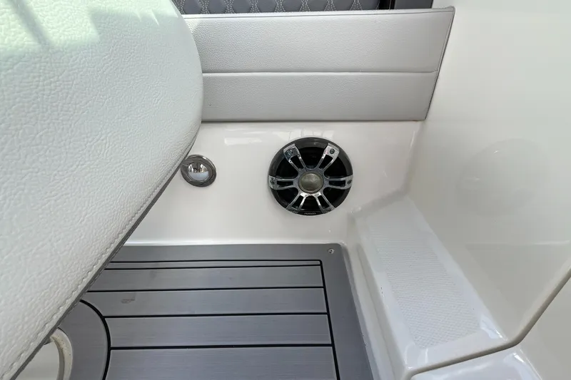 Slide: The Image of 2021 Sea Ray SLX 280 interior with speaker and sleek flooring design. - 56