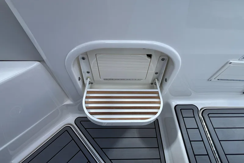 Slide: The Image of 2021 Sea Ray SLX 280 swim platform with teak-style step detail. - 57