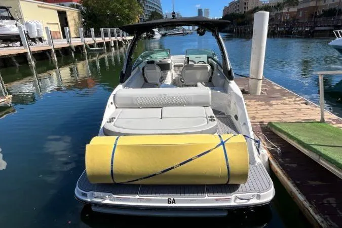 Slide: The Image of 2021 Sea Ray SLX 280 boat docked with yellow float on deck. - 6