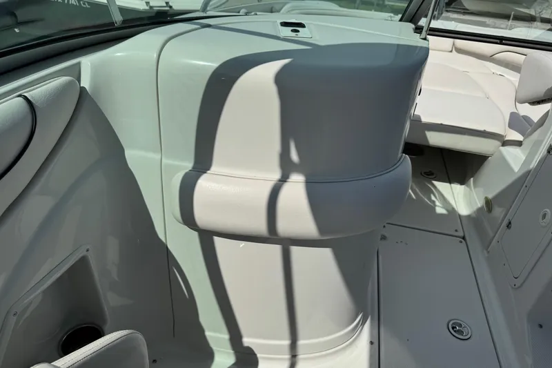 Slide: The Image of 2004 Crownline 248 BR boat interior with white seating and sleek design. - 19
