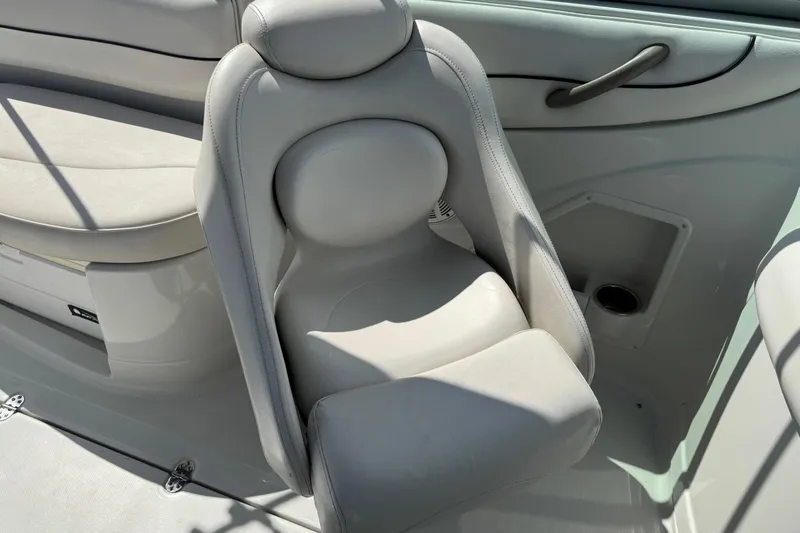 Slide: The Image of 2004 Crownline 248 BR boat interior with plush seating and sleek design. - 21