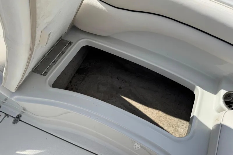 Slide: The Image of Open storage compartment in 2004 Crownline 248 BR boat interior. - 24