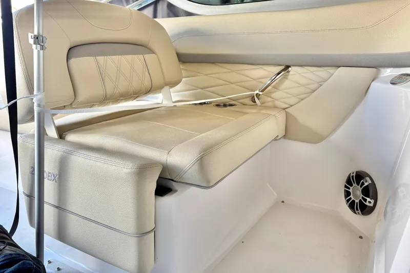 Slide: The Image of Luxurious seating in 2020 Regal 26 OBX boat, featuring beige upholstery and modern design. - 11