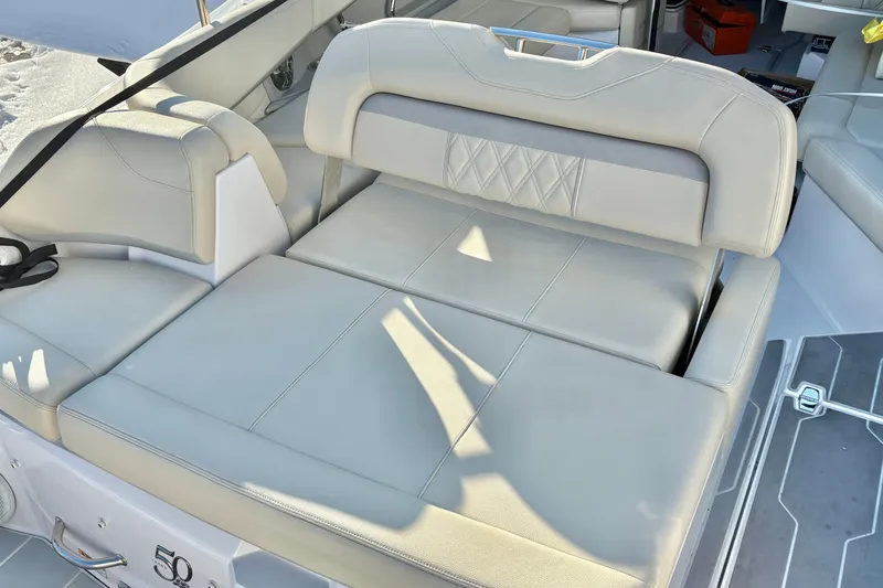 Slide: The Image of 2020 Regal 26 OBX boat interior with beige leather seating and modern design. - 31