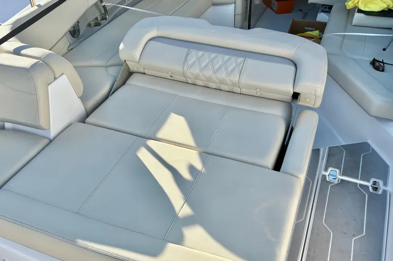 Slide: The Image of Luxurious seating on 2020 Regal 26 OBX boat, featuring plush, light-colored upholstery. - 32