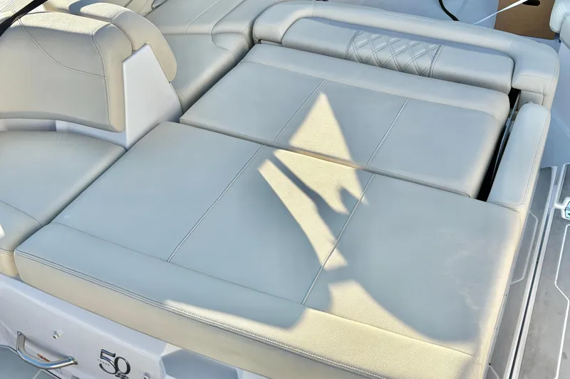 Slide: The Image of 2020 Regal 26 OBX boat with spacious, cushioned seating area. - 33